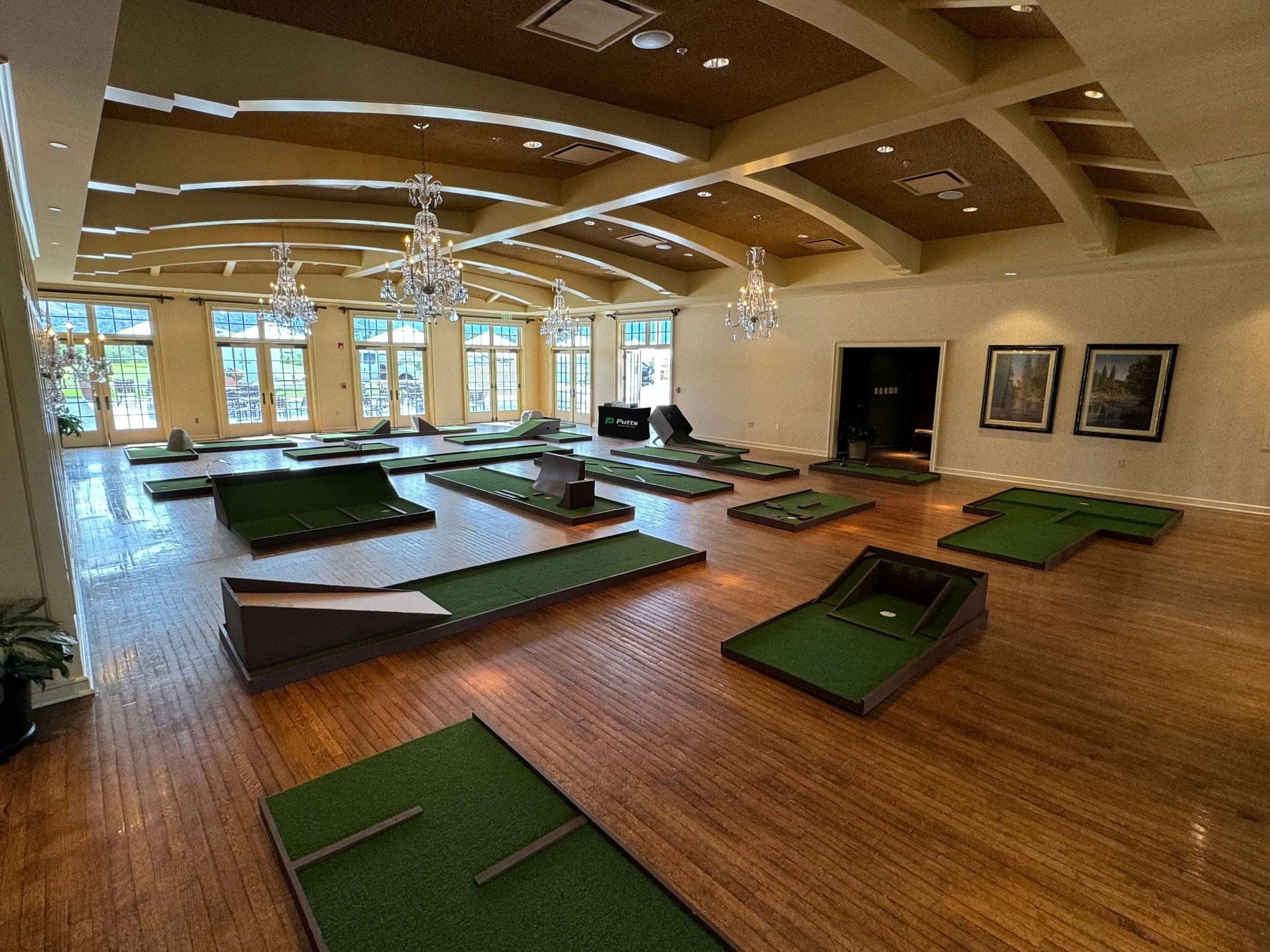 A full Putts course set up in a ballroom for a corporate event