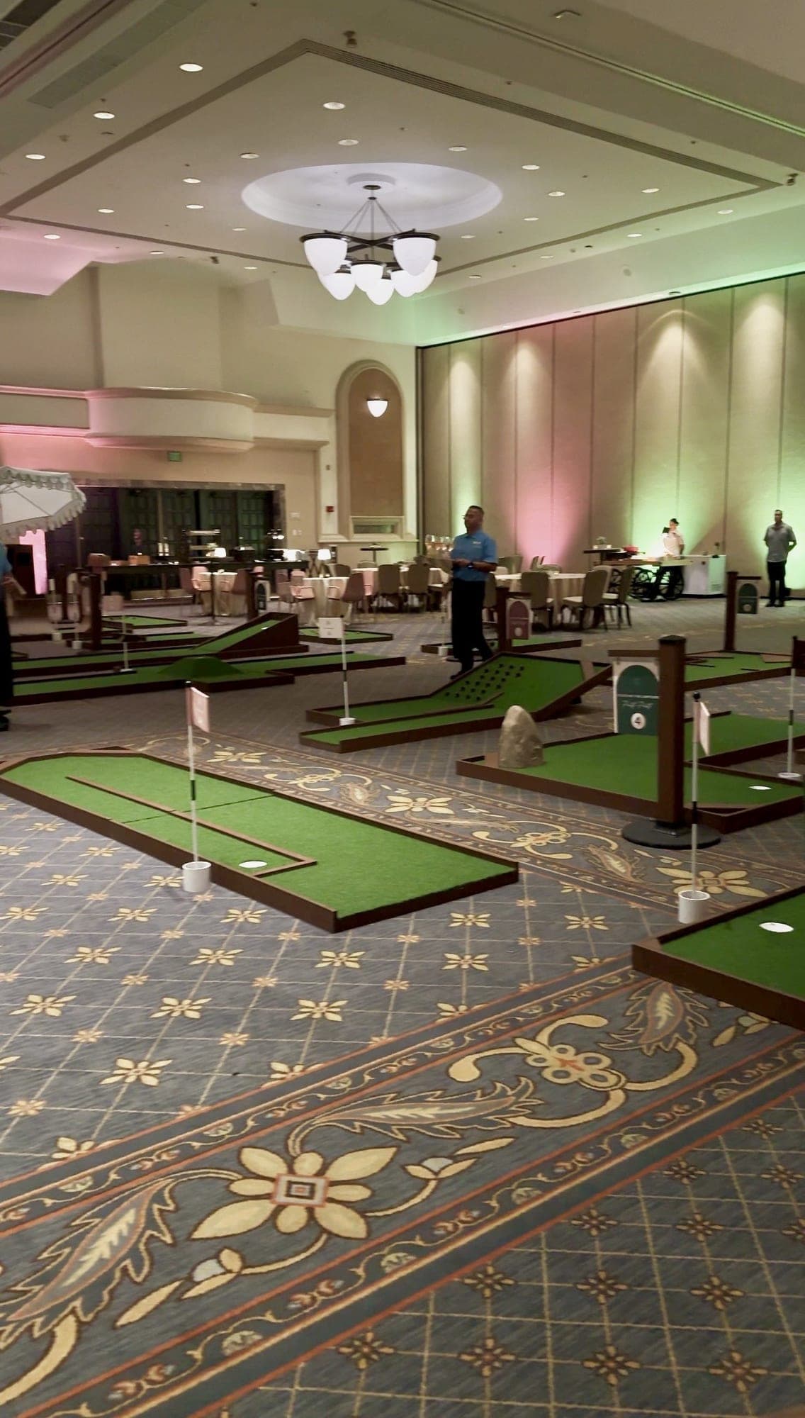 Guests in business attire playing Putts